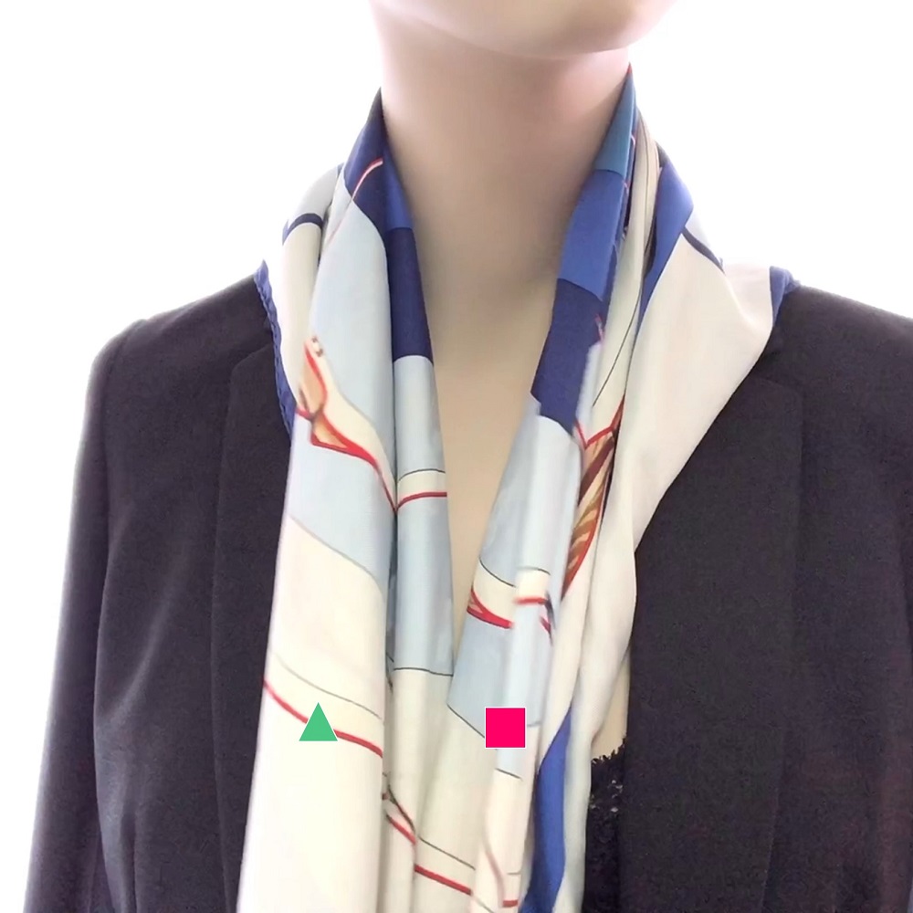 Step 2: Wrap the scarf in an inverted triangle at your back, with the ends drape naturally at the front.